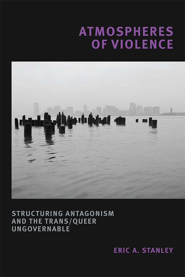Book cover of "Atmospheres of Violence" by Eric Stanley featuring a photo of piers in a bay with a hazy city in the distance