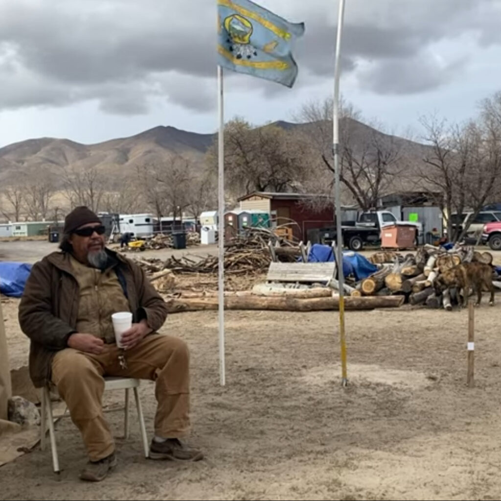 JJ Ayers sitting in front of a tent on WIC in 2021